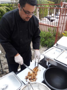 cutting the Italian sausage for create your own pasta bar